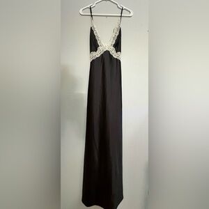 Black satin dress/white lace detail.The back is sexy with a criss-cross straps.